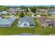 Aerial view showcasing the home's roof, lawn, and surrounding neighborhood in a suburban setting at 7178 Sw 113Th Loop, Ocala, FL 34476