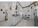 Bright dining area features tiled floors, a granite countertop, and arched windows at 7178 Sw 113Th Loop, Ocala, FL 34476