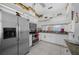 Bright kitchen featuring stainless steel appliances, granite countertops, and ample cabinet space at 7178 Sw 113Th Loop, Ocala, FL 34476