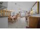 Open living space featuring tile flooring, dining area, decorative lighting, and lots of sunlight at 7178 Sw 113Th Loop, Ocala, FL 34476