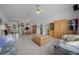 Bright living room featuring tile floors, ceiling fans, and lots of space for entertaining and relaxing at 7178 Sw 113Th Loop, Ocala, FL 34476