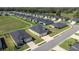 Aerial view of a neighborhood, showcasing the manicured lawns and green spaces at 7374 Sw 77Th Ave, Ocala, FL 34481