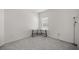 A clean and minimal bedroom with a window and carpeted floors at 7374 Sw 77Th Ave, Ocala, FL 34481