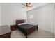 Cozy bedroom features a ceiling fan, neutral flooring, and a window at 7374 Sw 77Th Ave, Ocala, FL 34481