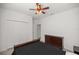 Bedroom featuring carpet floors, closet, ceiling fan and dark wood dresser at 7374 Sw 77Th Ave, Ocala, FL 34481