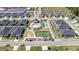 Aerial view of community amenities including a pool, tennis and bocce ball courts at 7374 Sw 77Th Ave, Ocala, FL 34481