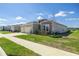Landscaped single-Gathering home featuring a two-car garage at 7374 Sw 77Th Ave, Ocala, FL 34481
