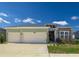 Charming single-Gathering home featuring a two-car garage, well-manicured lawn and pleasing curb appeal at 7374 Sw 77Th Ave, Ocala, FL 34481