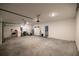 A large two car garage features lighting and plenty of room for parking and storage at 7374 Sw 77Th Ave, Ocala, FL 34481