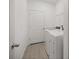 Laundry room with a white washer and dryer and tile floors at 7374 Sw 77Th Ave, Ocala, FL 34481