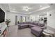 Bright living space boasts modern decor, tray ceiling, and seamless flow to the kitchen at 7374 Sw 77Th Ave, Ocala, FL 34481