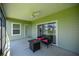 Covered patio with room for seating and entertaining at 7374 Sw 77Th Ave, Ocala, FL 34481