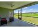 Screened porch with ceiling fan overlooking backyard at 7374 Sw 77Th Ave, Ocala, FL 34481