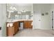 Well-lit bathroom featuring double sinks, and tiled flooring at 8782 Sw 82Nd Court Rd, Ocala, FL 34481