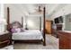 Comfortable bedroom with ample natural light, ceiling fan, and wood flooring at 8782 Sw 82Nd Court Rd, Ocala, FL 34481