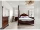 This spacious bedroom features a ceiling fan and wood-look flooring at 8782 Sw 82Nd Court Rd, Ocala, FL 34481