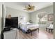 Inviting bedroom with wood floors, ceiling fan, and natural light at 8782 Sw 82Nd Court Rd, Ocala, FL 34481