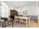 Bright dining room with a chandelier, white table, and a display cabinet at 8782 Sw 82Nd Court Rd, Ocala, FL 34481