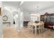 Open dining area with tile and laminate floors, adjacent to the entryway and living spaces at 8782 Sw 82Nd Court Rd, Ocala, FL 34481