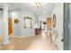 Spacious foyer with tile flooring, columns, and elegant furnishings, leading to living spaces at 8782 Sw 82Nd Court Rd, Ocala, FL 34481