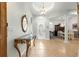Elegant foyer with tile flooring, chandelier, and a decorative table, leading to the dining area at 8782 Sw 82Nd Court Rd, Ocala, FL 34481
