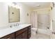 Bathroom with neutral color walls, dark wood cabinets and a shower/tub at 9504 Sw 97Th Ln # B, Ocala, FL 34481
