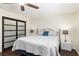 Bedroom featuring a ceiling fan, hardwood floors, and sliding closet doors at 9504 Sw 97Th Ln # B, Ocala, FL 34481
