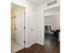 Hallway with hardwood floors leading into a bedroom and bathroom at 9504 Sw 97Th Ln # B, Ocala, FL 34481
