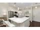 Modern kitchen with white cabinets, stainless steel appliances, and a large island with seating at 9504 Sw 97Th Ln # B, Ocala, FL 34481