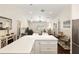 Open floor plan from kitchen island looking towards living area at 9504 Sw 97Th Ln # B, Ocala, FL 34481