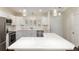 Well-lit kitchen with stainless steel appliances, white cabinetry, and a spacious layout at 9504 Sw 97Th Ln # B, Ocala, FL 34481