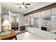 Bright lanai with tile floors, lots of windows and ceiling fan at 9504 Sw 97Th Ln # B, Ocala, FL 34481