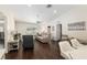 Spacious living room with ample seating, modern decor, and hardwood floors at 9504 Sw 97Th Ln # B, Ocala, FL 34481