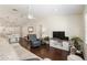 Spacious living room with a ceiling fan, hardwood floors, and an open floor plan at 9504 Sw 97Th Ln # B, Ocala, FL 34481