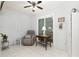 Relaxing sunroom with recliner, side table, and decor at 9504 Sw 97Th Ln # B, Ocala, FL 34481