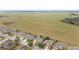 An aerial view of a residential area bordering on expansive open fields and farmland at 9863 Sw 63Rd Loop, Ocala, FL 34481
