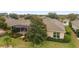 Birds eye view of home highlighting screen enclosed lanai, mature trees, and well manicured landscape at 9863 Sw 63Rd Loop, Ocala, FL 34481