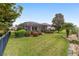 A spacious backyard with a screened-in porch and well-maintained landscaping for enjoying the outdoors at 9863 Sw 63Rd Loop, Ocala, FL 34481