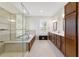 Bright bathroom featuring a soaking tub, large shower, double sinks, and plantation shutters at 9863 Sw 63Rd Loop, Ocala, FL 34481