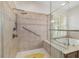 Bathroom featuring walk-in shower and soaking tub with tiled surround at 9863 Sw 63Rd Loop, Ocala, FL 34481