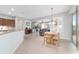 Eat in kitchen featuring stainless steel appliances and access to the living room and patio at 9863 Sw 63Rd Loop, Ocala, FL 34481