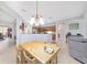 Kitchen view showing stainless steel appliances, breakfast bar and access to other rooms at 9863 Sw 63Rd Loop, Ocala, FL 34481