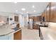 Bright kitchen features stainless appliances, light countertops, and abundant wooden cabinetry at 9863 Sw 63Rd Loop, Ocala, FL 34481