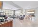 Bright living room with tile floors, neutral paint, white sofas, and large windows with plantation shutters at 9863 Sw 63Rd Loop, Ocala, FL 34481