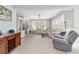 Bright living room features tile floors, natural light, and comfortable seating at 9863 Sw 63Rd Loop, Ocala, FL 34481