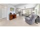Open concept living room features tile floors, natural light, wine rack and comfortable seating at 9863 Sw 63Rd Loop, Ocala, FL 34481