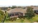 Aerial view of a home featuring a screened in lanai perfect for outdoor lounging and entertaining at 9863 Sw 63Rd Loop, Ocala, FL 34481
