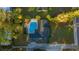 Aerial view of house, property and sparkling blue swimming pool at 4040 E Fort King St, Ocala, FL 34470