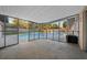 View of the enclosed patio, providing a serene space to enjoy the view of the pool at 4040 E Fort King St, Ocala, FL 34470