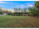 A charming one-story brick home with well-maintained lawn and mature landscaping at 4040 E Fort King St, Ocala, FL 34470